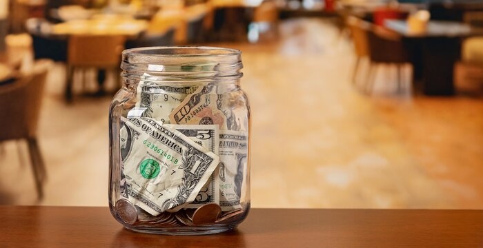 Tip jar in restaurant dining room