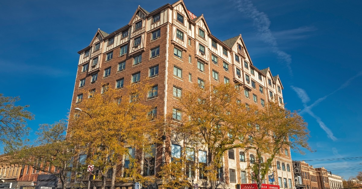alex johnson hotel located on corner of street with autumn trees and vacant roads in downtown south dakota