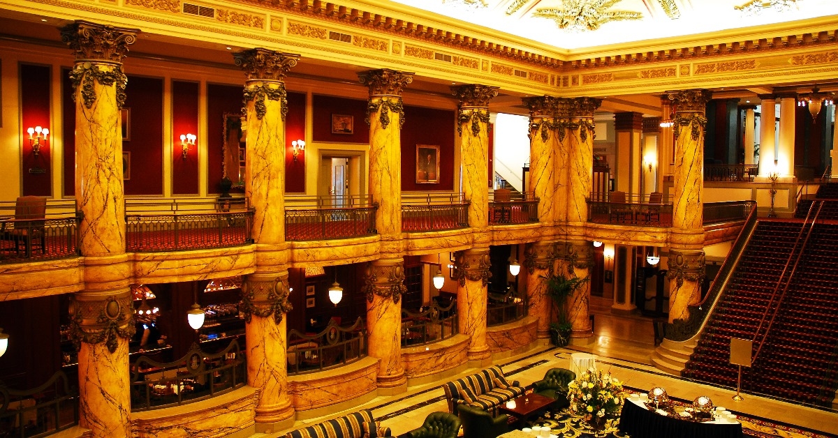 atrium and lobby of historic thomas jefferson hotel with golden and red theme in richmond virginia