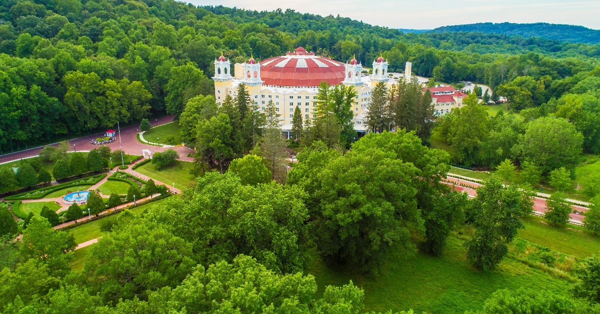 west baden springs hotel surrounded with lush green landscape in french lick indiana during day time