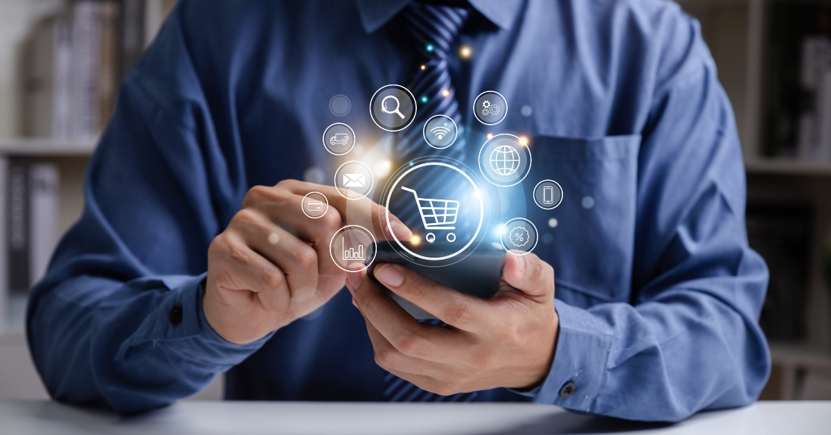 young man using smartphone with shopping cart icon