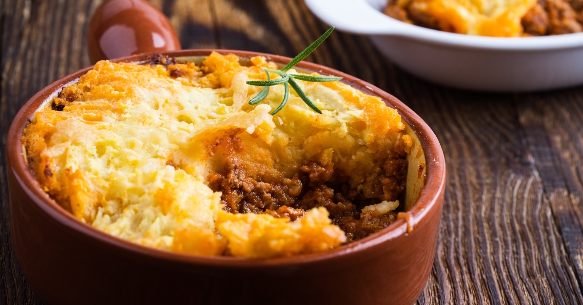 Shepherd's pie a traditional British dish, made from lamb or mutton and mashed potatoes served in red beautiful bowls