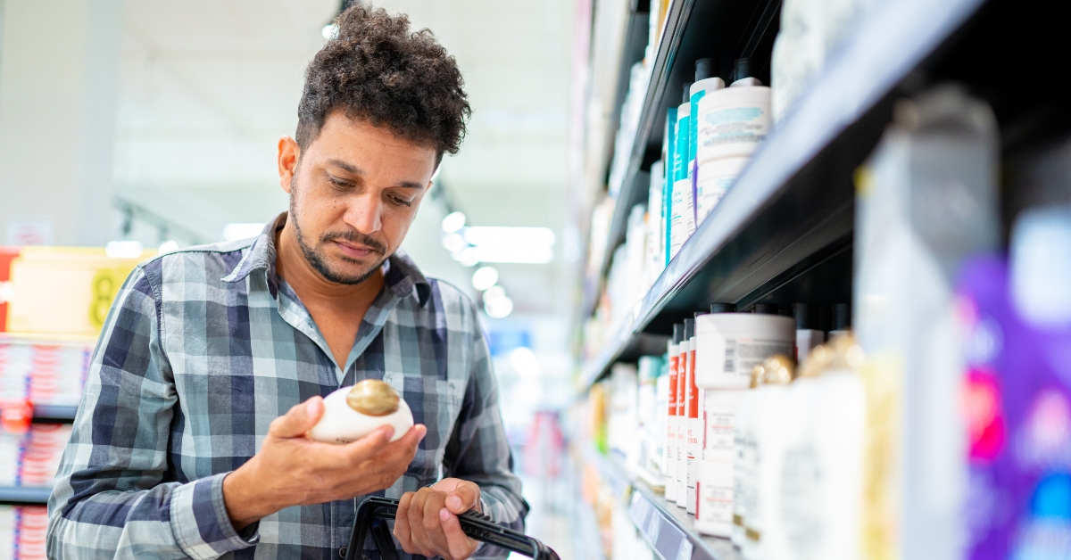 customer choosing a men's hair product