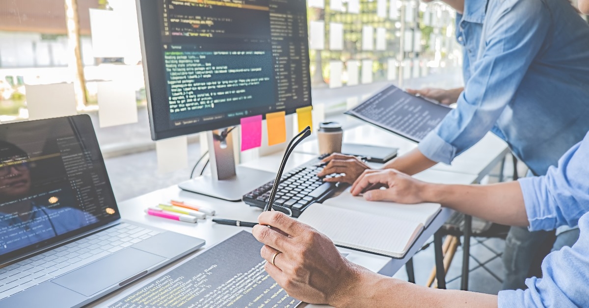 A programmer is seen running a programming code and analyzing results during the software development process.