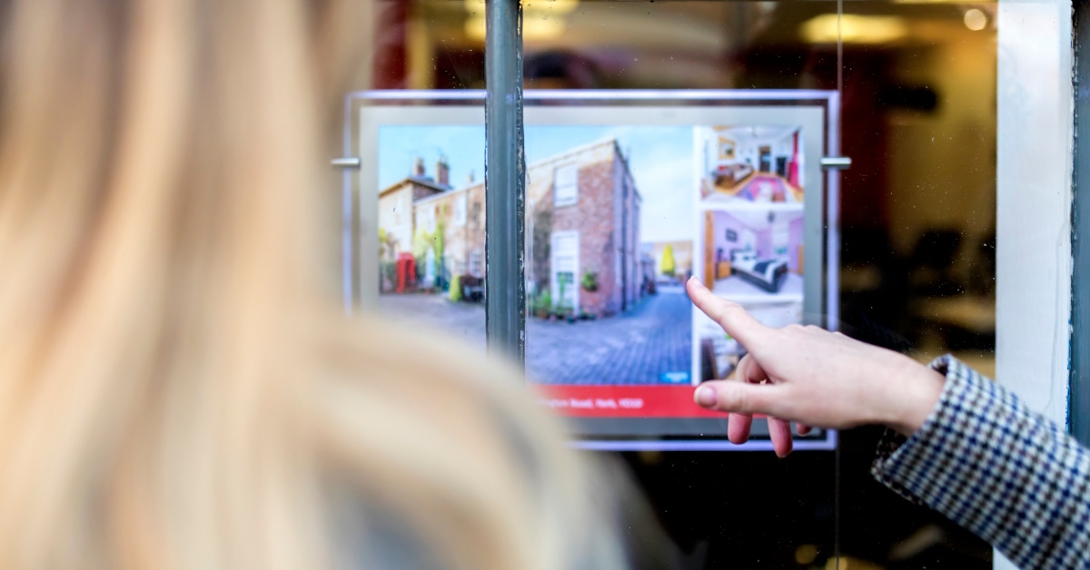 People looking at real estate listing