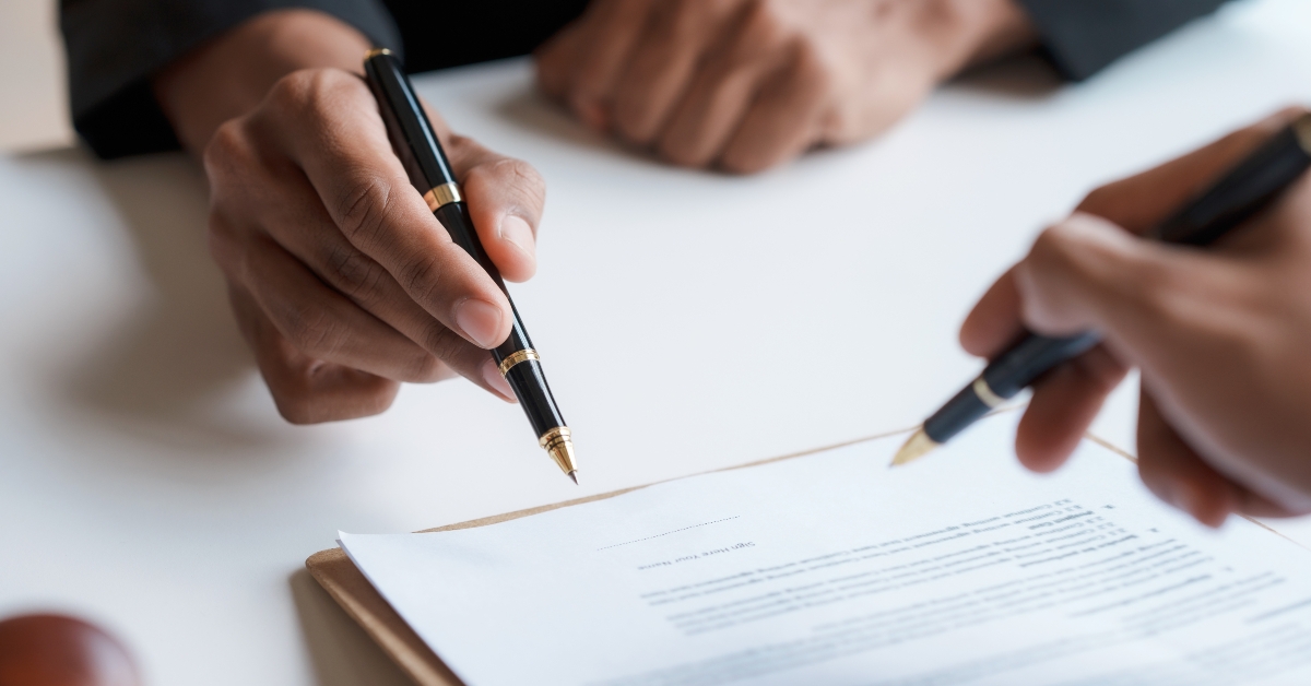 lawyer and client signing