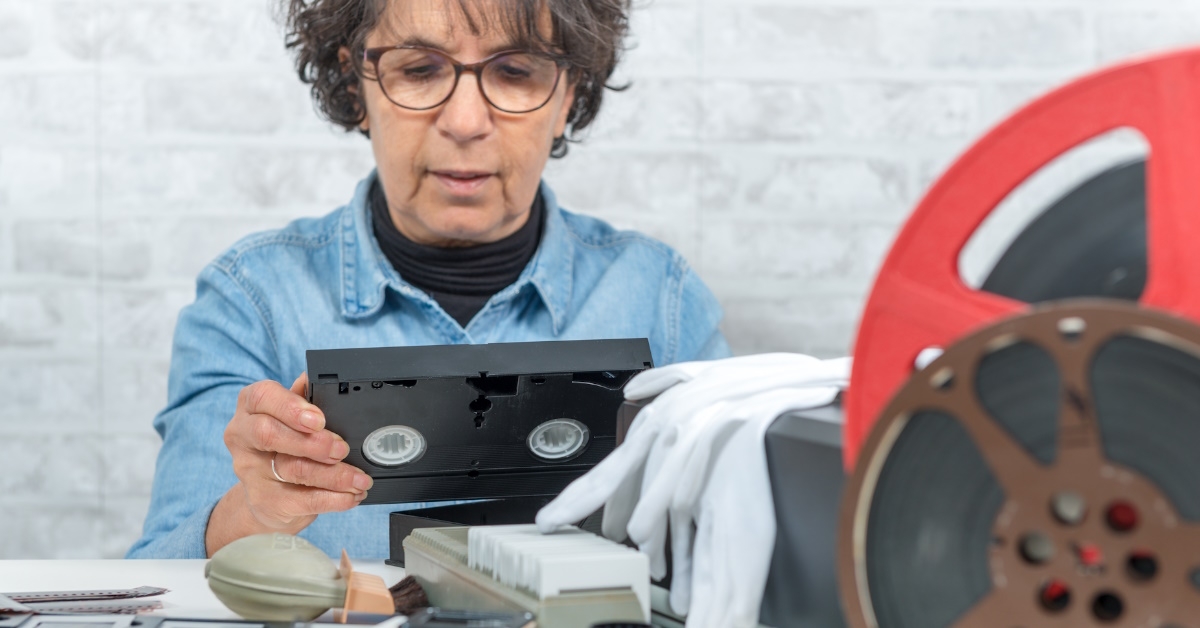 female technician reviewing cassettes
