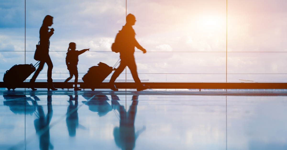 family with kids in airport lounge
