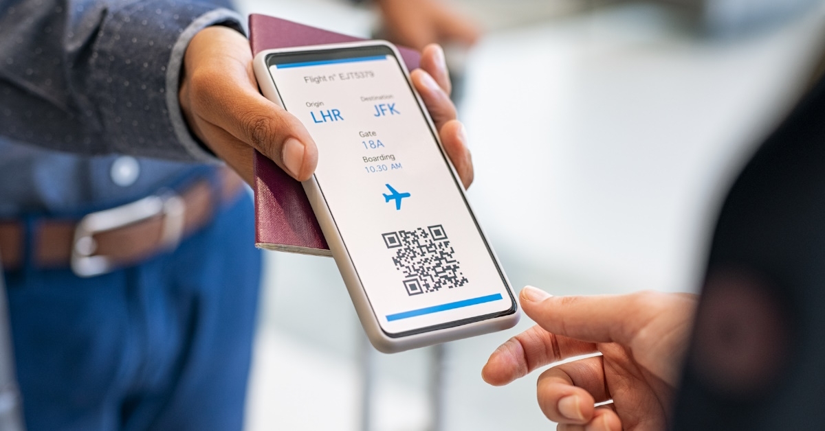 man showing boarding pass on smartphone