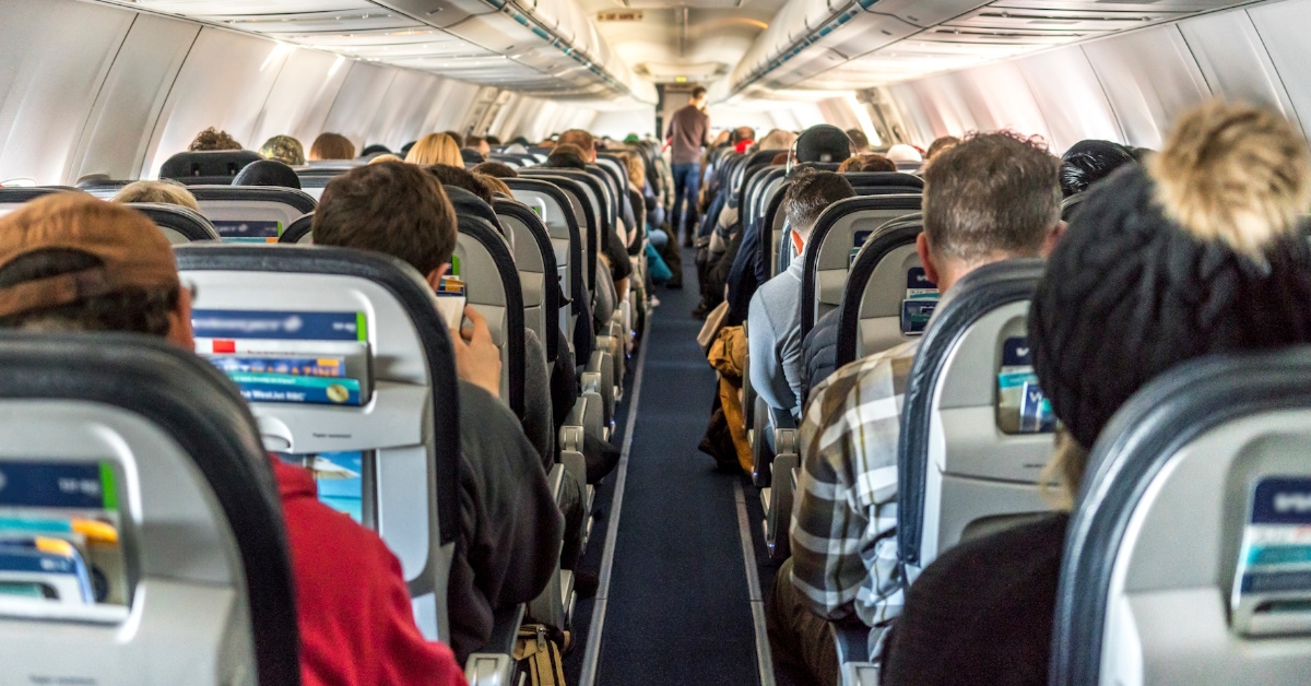 passengers sitting in commercial airplane