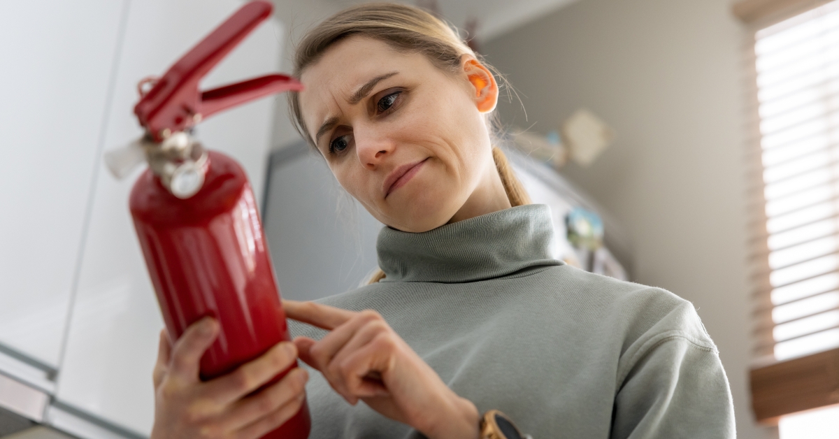 woman check the fire extinguisher
