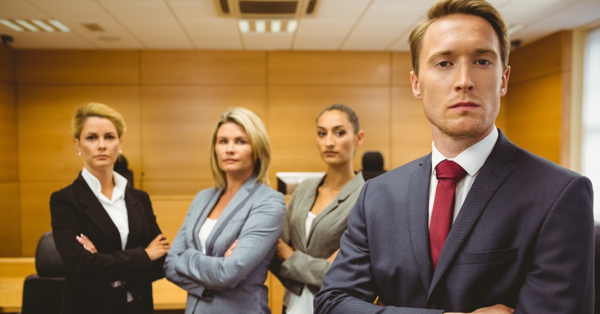 lawyer standing with arms crossed