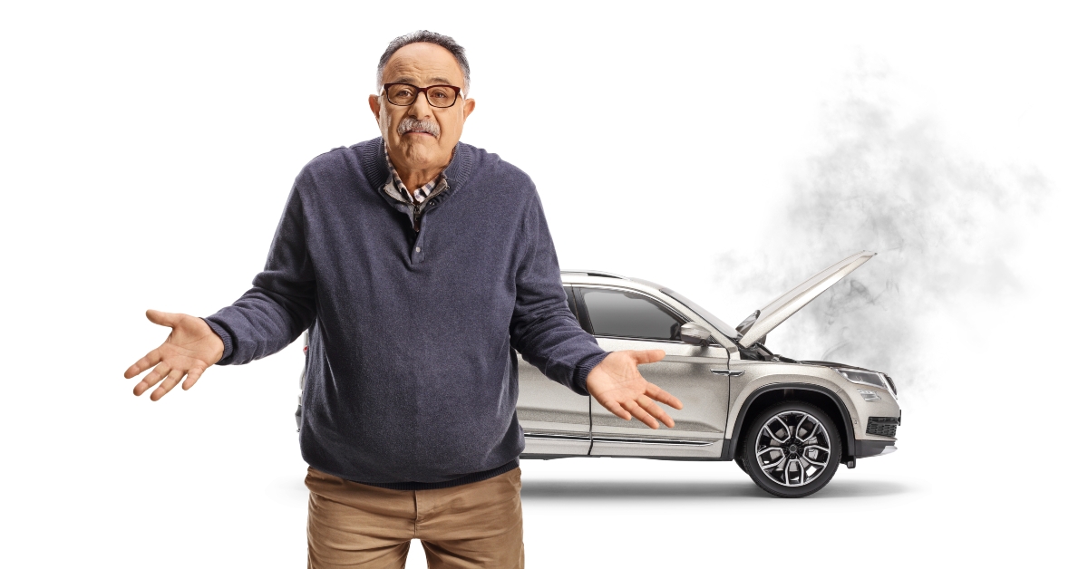 mature man and a broken car