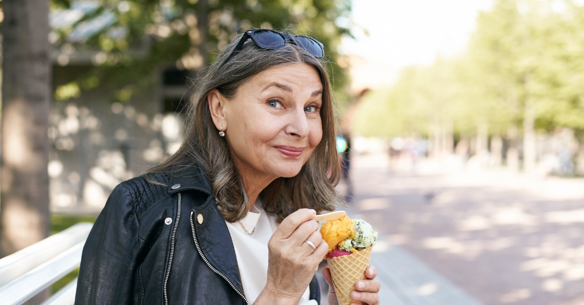 woman eating multi-flavoured icecream.