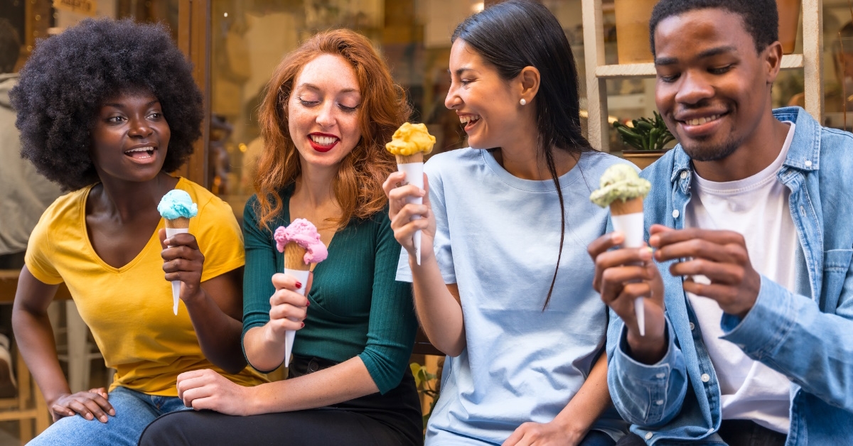 friends sitting in ice cream parlor.