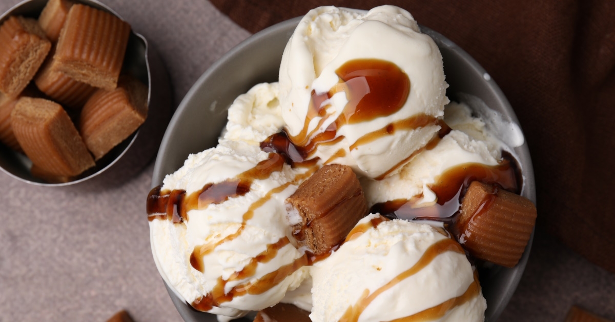 ice cream with caramel sauce and candies.