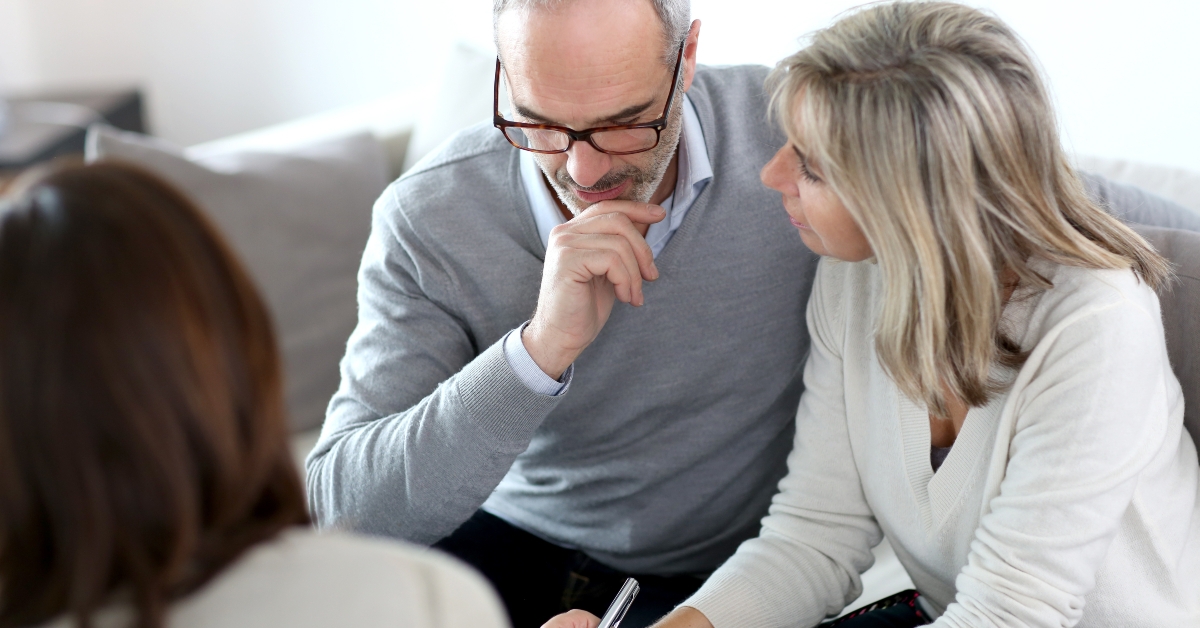 senior couple meeting financial adviser