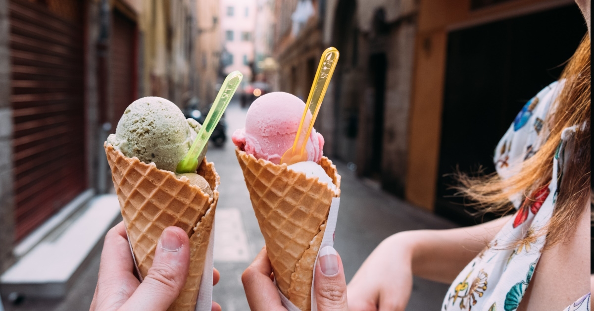 strawberry and pistachio flavoured ice cream cone.