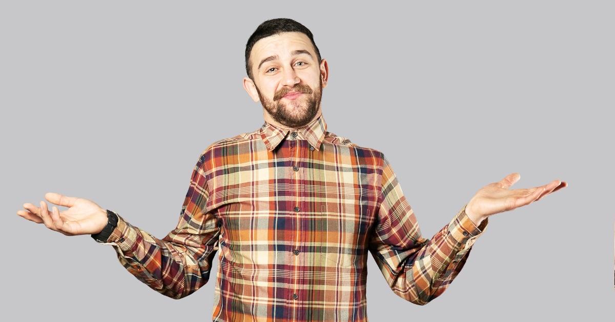 confident handsome man over grey wall