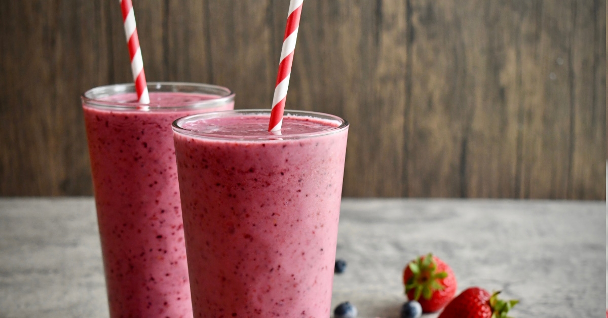 glass of berry smoothies at table