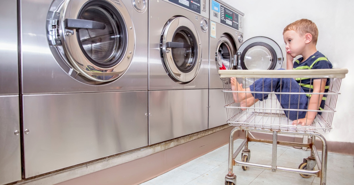 bored boy in the public laundry
