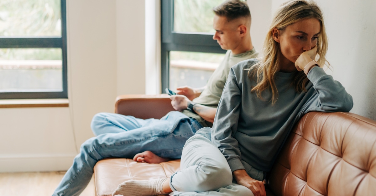 Sad couple after argument at home