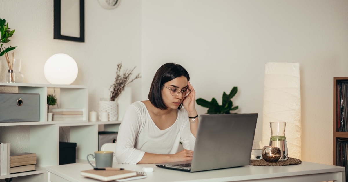 Woman feeling tired at computer