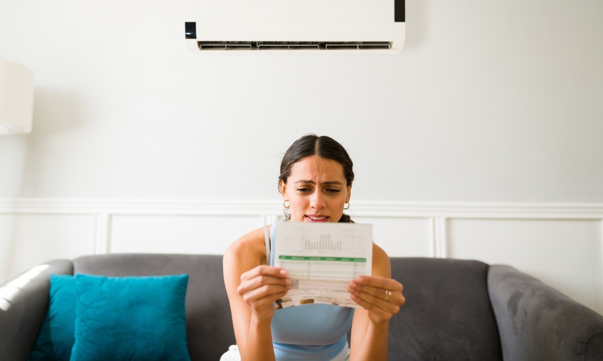 Sad woman looking at bill