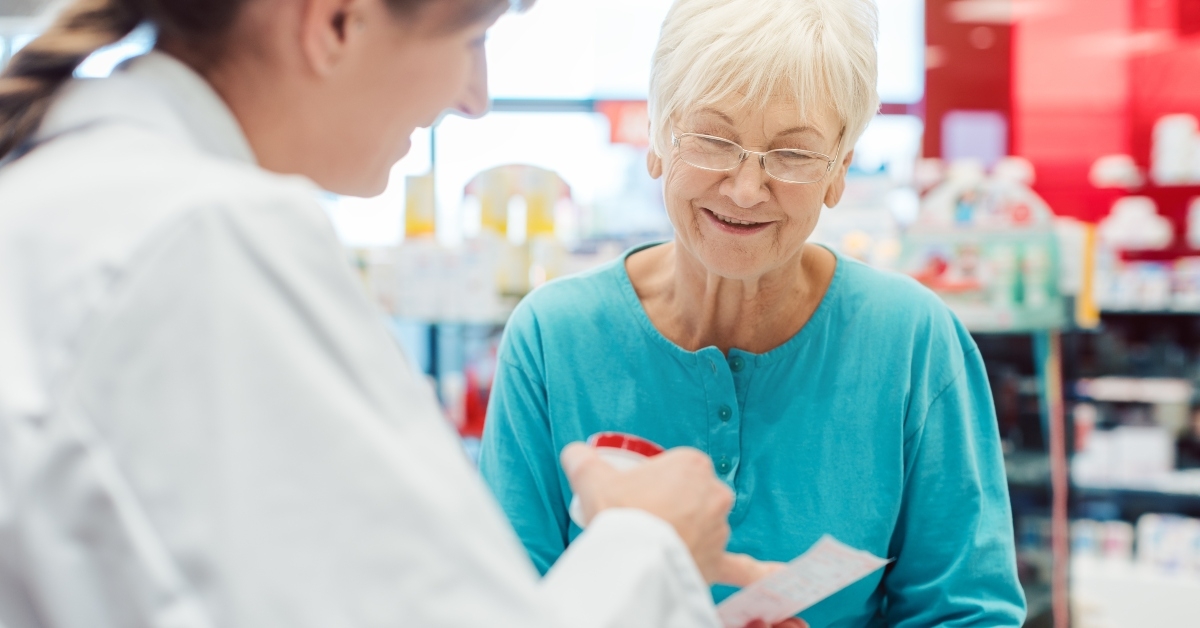 Pharmacist with senior patient