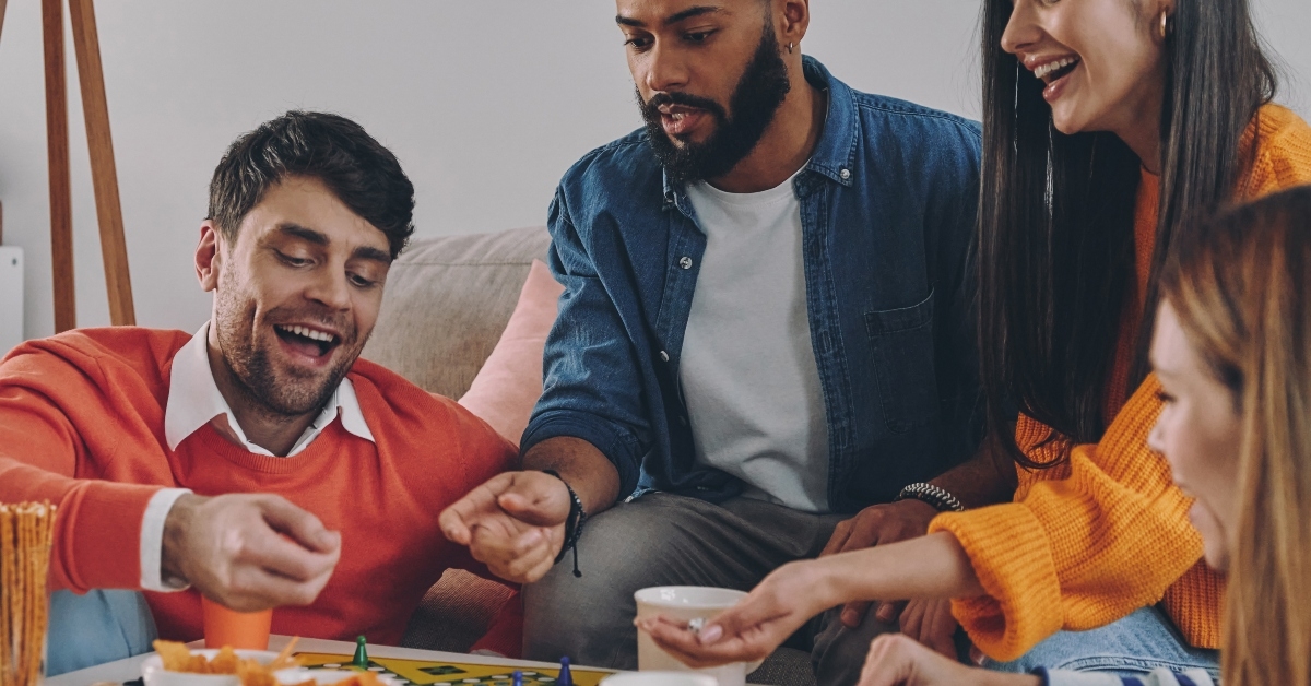 Young people playing board game