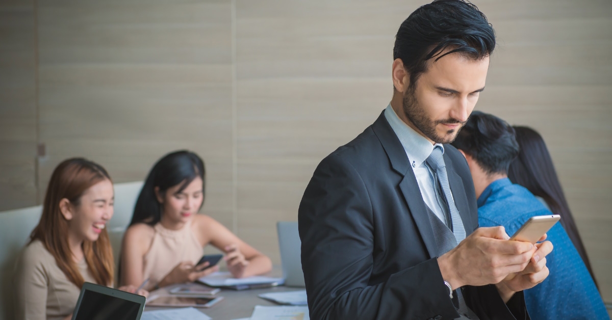 Businessman using smartphone at work