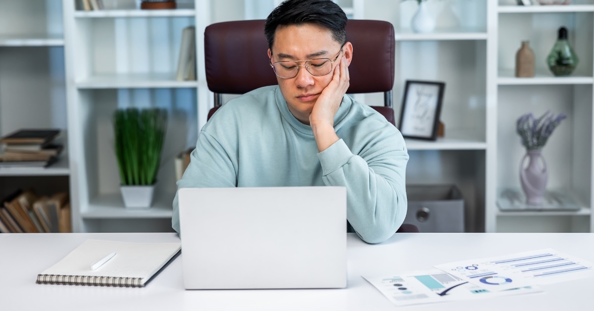 Sad man looking at computer