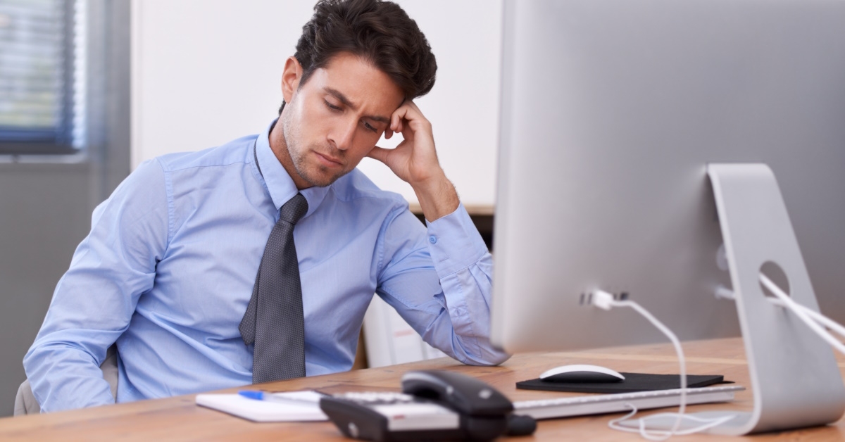 Business man frustrated at work