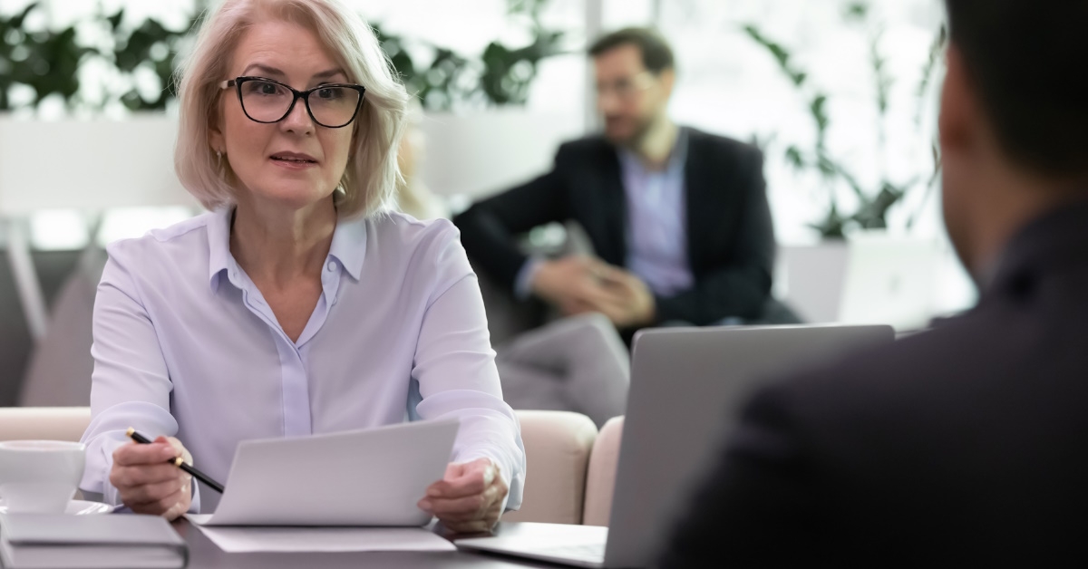 business woman interviewing male candidate