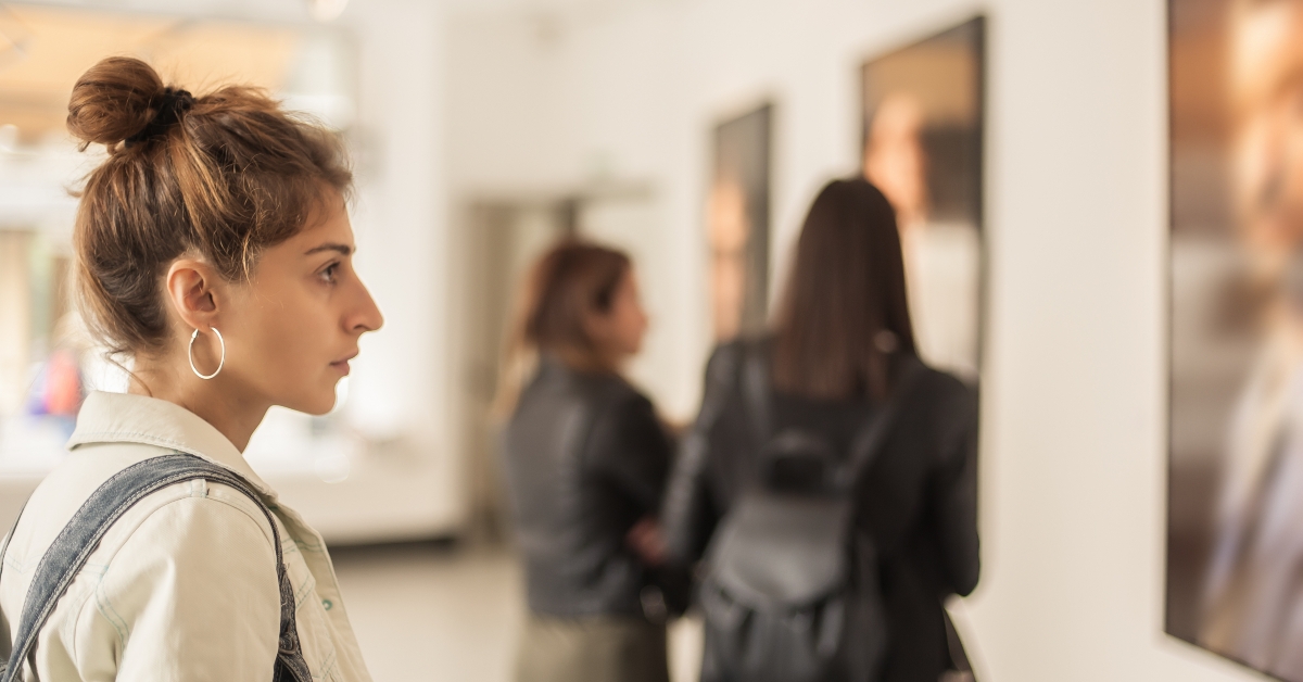 woman looking at modern painting