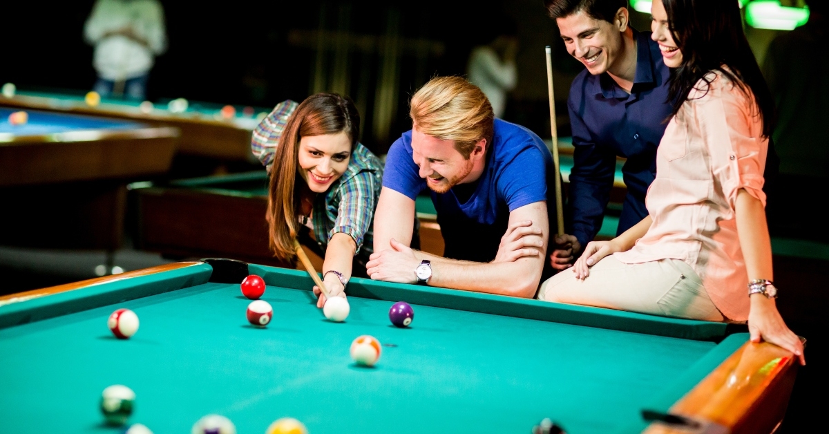 Young people playing pool