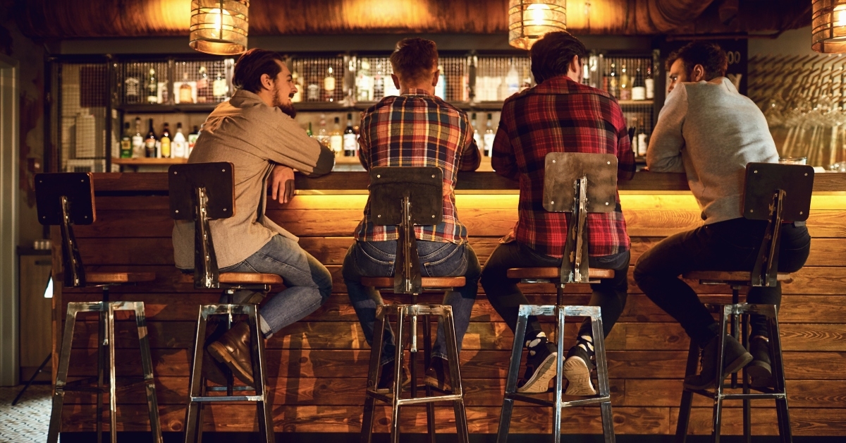 Friends talking at the bar