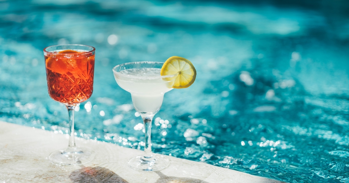 Refreshing cocktail near swimming pool