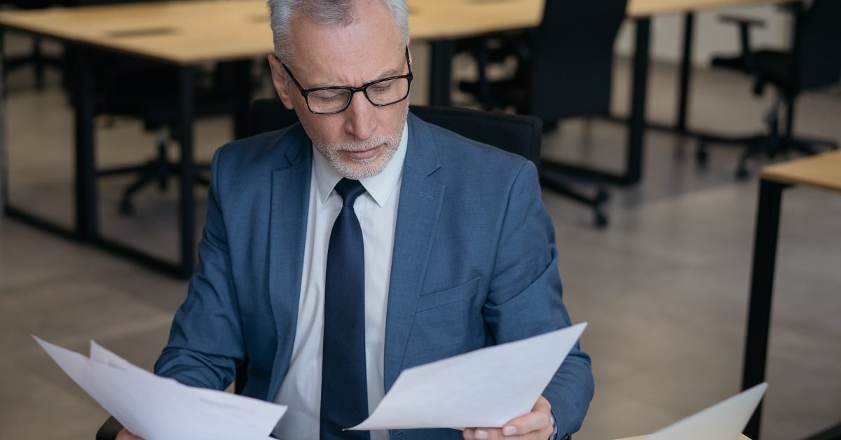 Businessman reading financial report