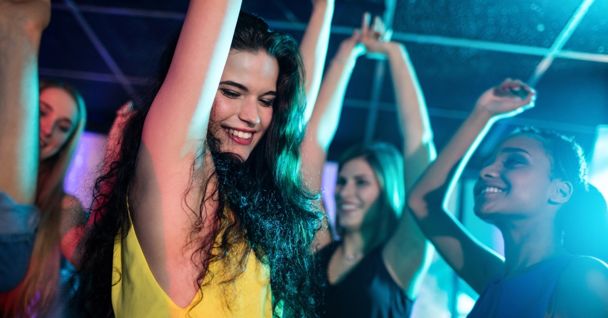  friends dancing on dance floor