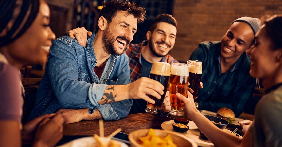 friends toast with beer