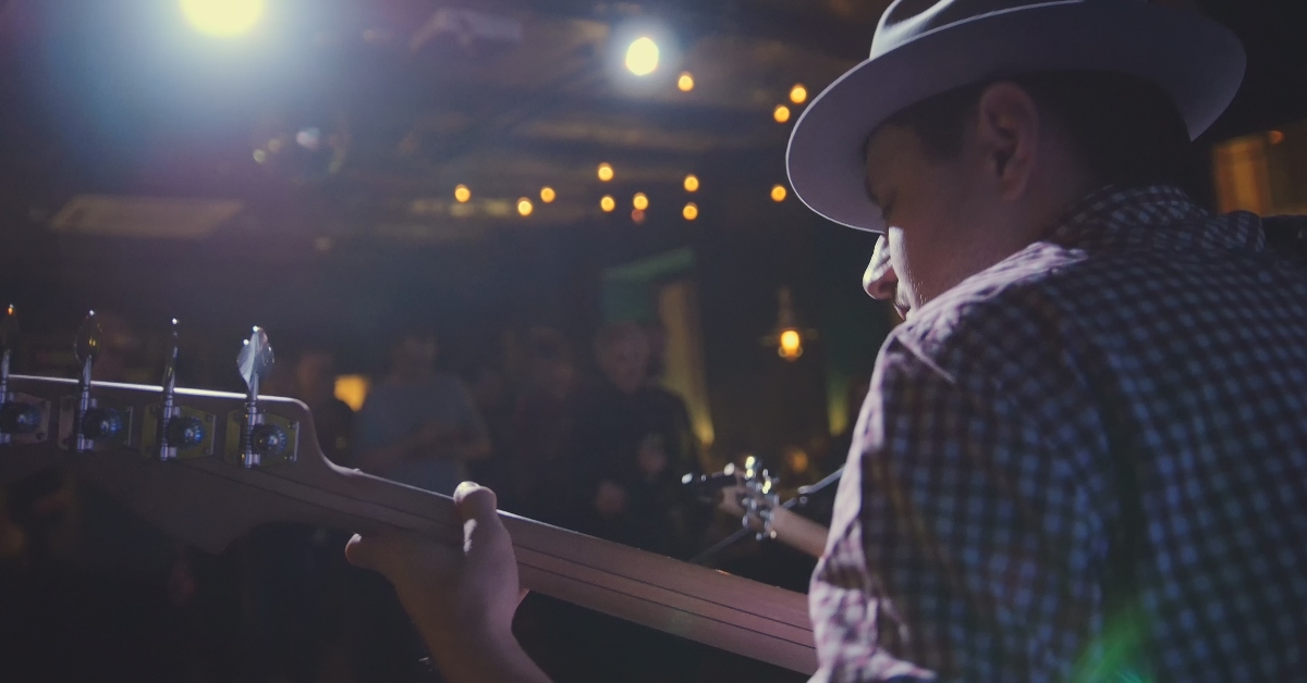 guitarist in hat plays guitar