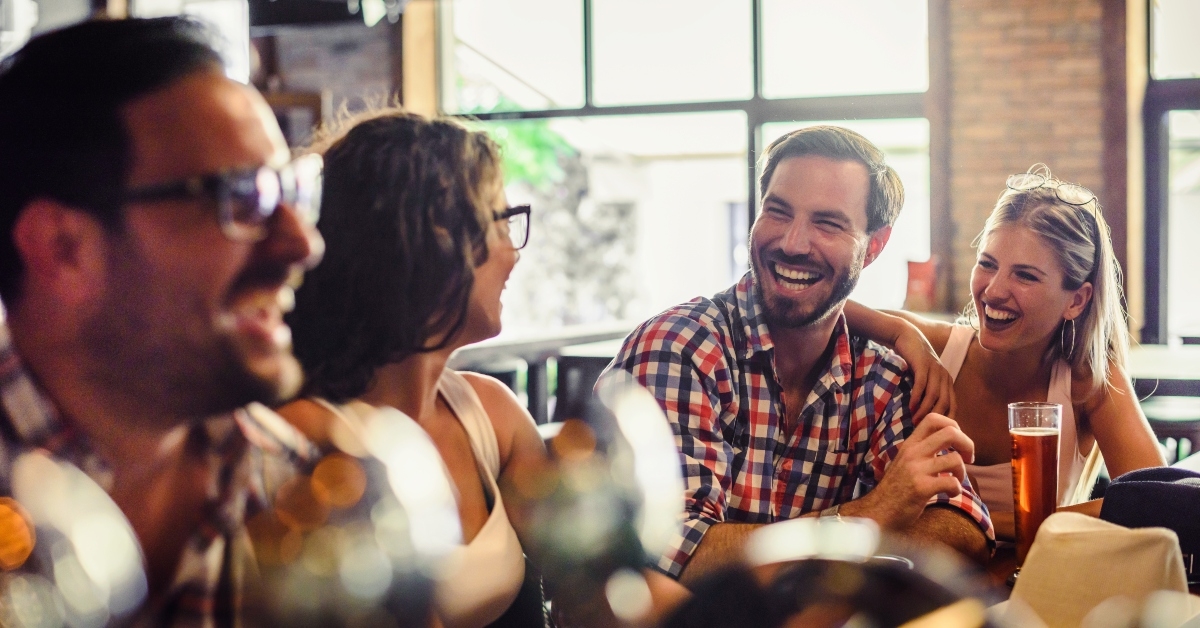happy friends having fun at bar