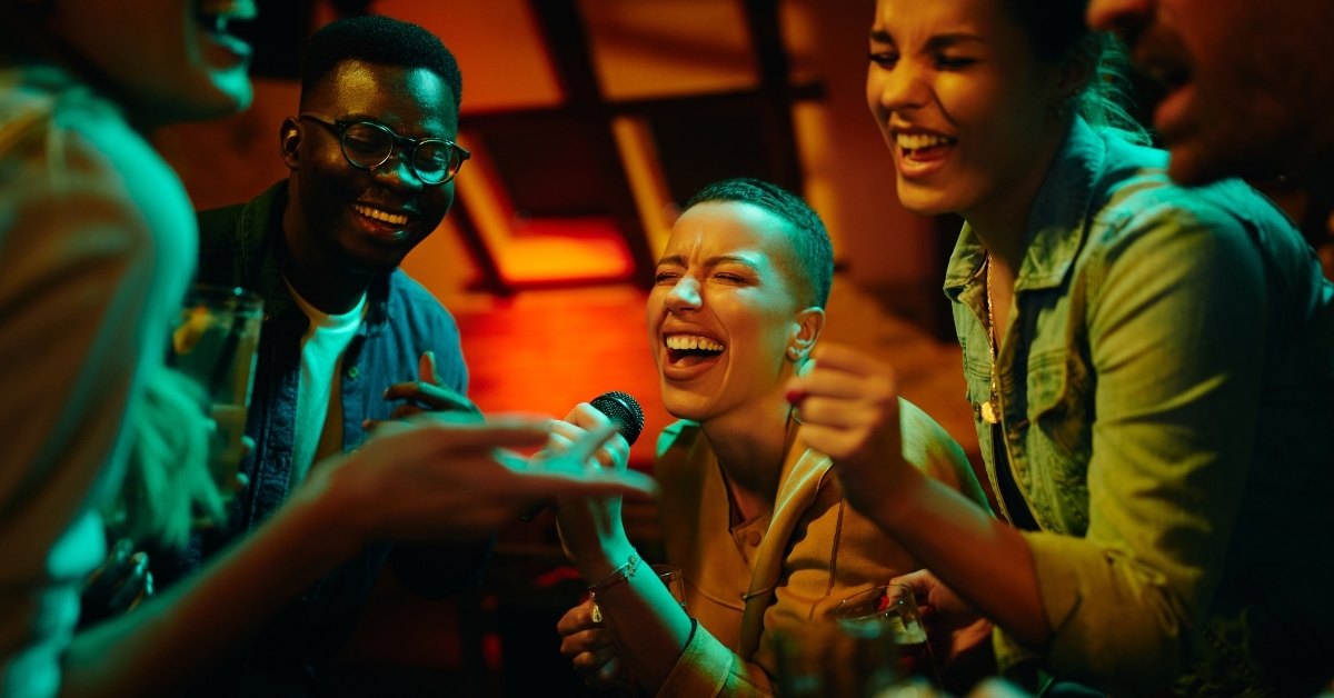 happy friends singing karaoke
