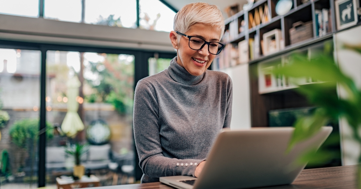 Mature businesswoman working on laptop