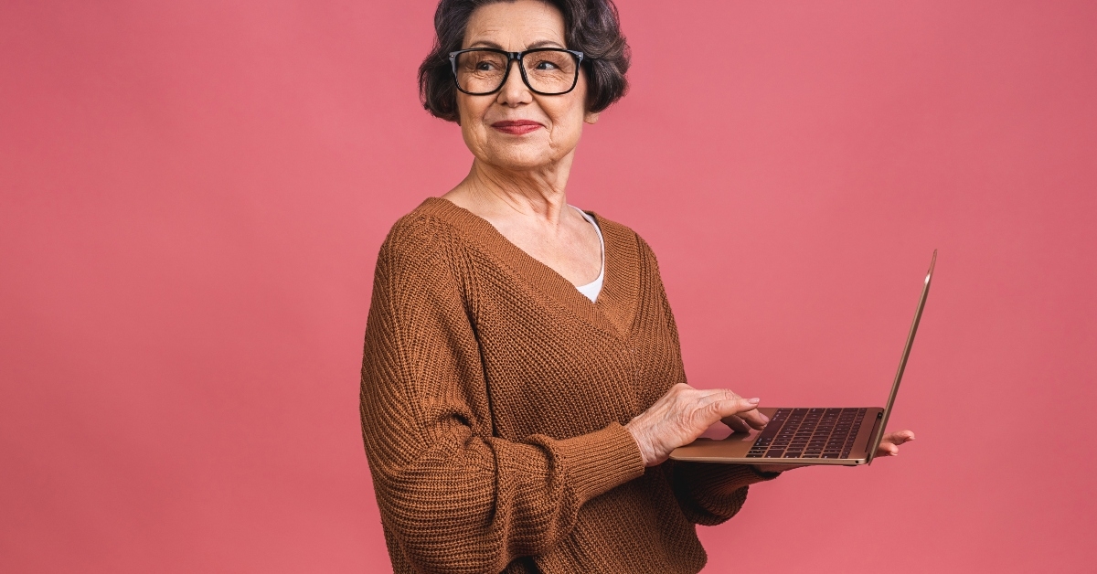 Senior aged business woman with laptop