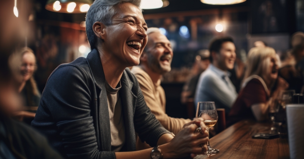 woman laughs at a stand-up performance