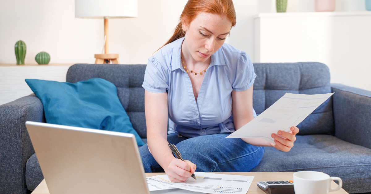 Woman looking at bill
