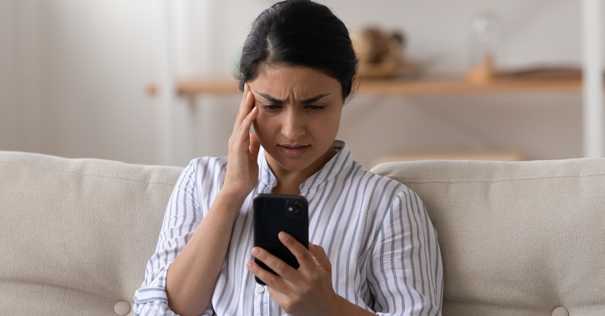 Woman looking at phone screen