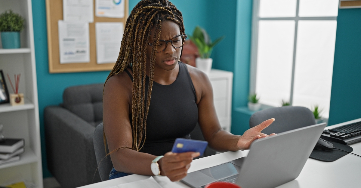 Woman looking upset at laptop